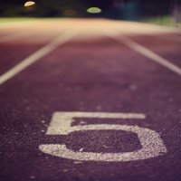 Runner crossing 5k finish line