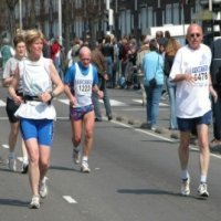 Runner tackling challenging cross country terrain with hills and obstacles