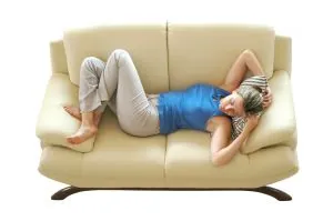 person lying on a couch, resting