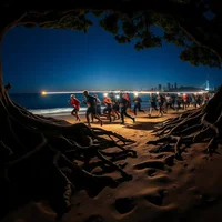 Group of runners on a beach at night with illuminated city skyline visible in the distance