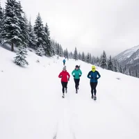 Small group of winter runners jogging through snowy mountain trail with evergreen trees under overcast sky